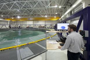 Dr Tom Davey operating the FloWave tank from beside the basin.